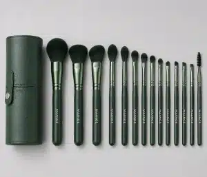 YT-SMB-010 vegan synthetic makeup brushes 15 pieces shown in matching emerald green leather cylinder
