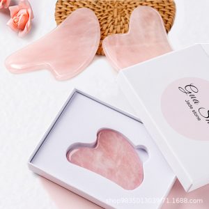 Heart-shaped wholesale rose quartz gua sha tool for B2B private label beauty brands.
