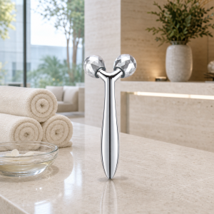 Wholesale 3D facial roller with faceted silver rollers for jawline contouring and facial massage, available for custom bulk orders.