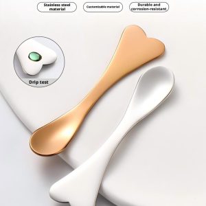 Three YITHONIA gold, silver, and rose gold heart-shaped wholesale cosmetic spatula scoop options shown in file 1.jpg.