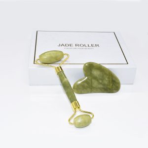 Green heart-shaped wholesale jade gua sha tool for B2B private label beauty brands.