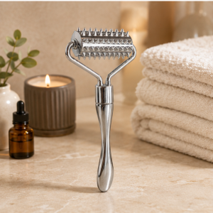 Wholesale spiked metal facial roller with a textured stainless steel head for stimulating massage, available for bulk OEM orders.