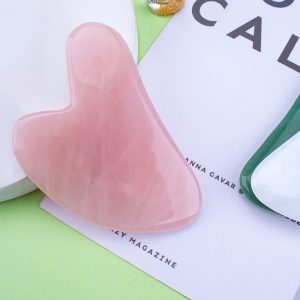 Heart-shaped wholesale rose quartz gua sha tool for B2B private label beauty brands.
