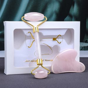 Wholesale rose quartz facial roller and gua sha set with gold accents for private label beauty brands and retailers.