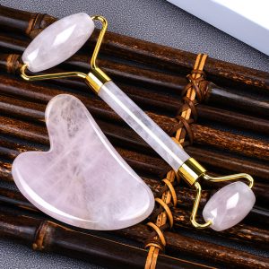 Wholesale rose quartz facial roller and gua sha set with gold accents for private label beauty brands and retailers.