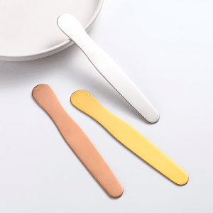 Large round stainless steel mask spatula for skincare jars and cosmetic packaging